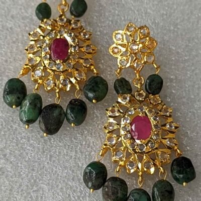 Pair of Rifa Danglers earrings - Emerald and ruby, Rifa Danglers earrings displayed with jewelry box