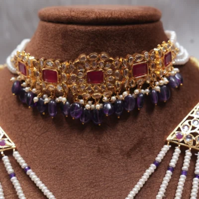 Soma Bridal Jewellery Set featuring a heavy necklace with ruby and amethyst accents.
